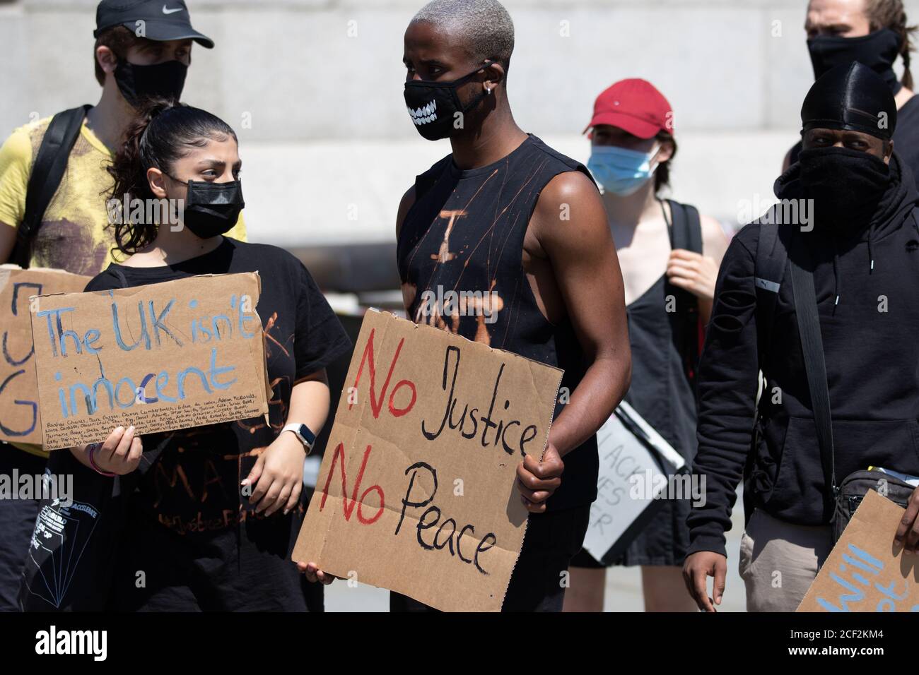 Protesters With Signs Black Lives Matter protesters hold signs at a protest in Trafalgar ...
