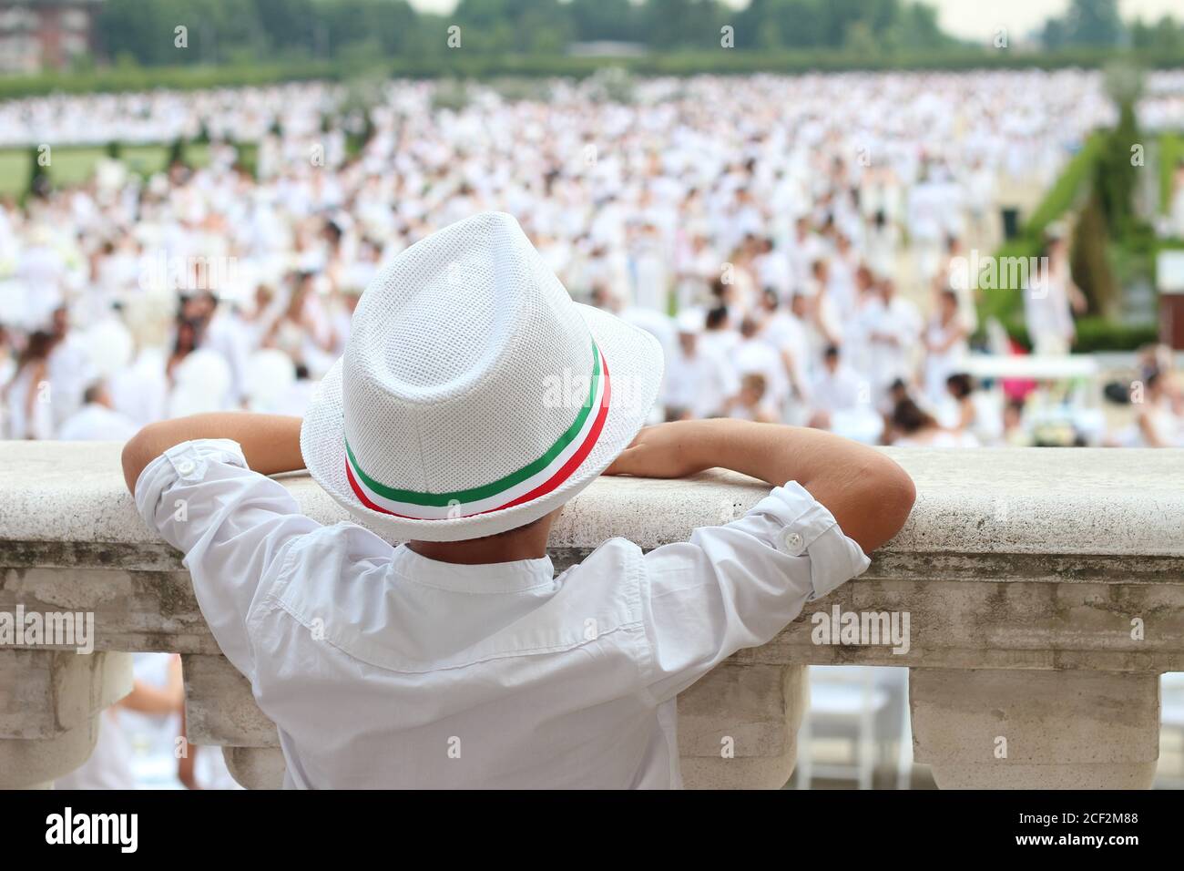 a young boy with white hat and shirt Stock Photo