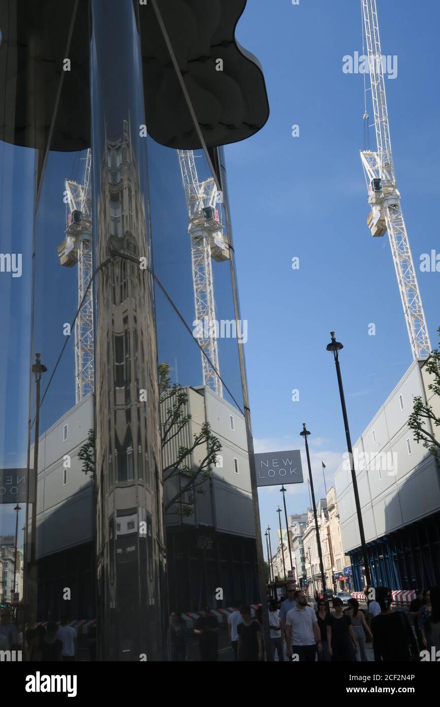 London Oxford Street building cranes and activity, reflections Stock Photo