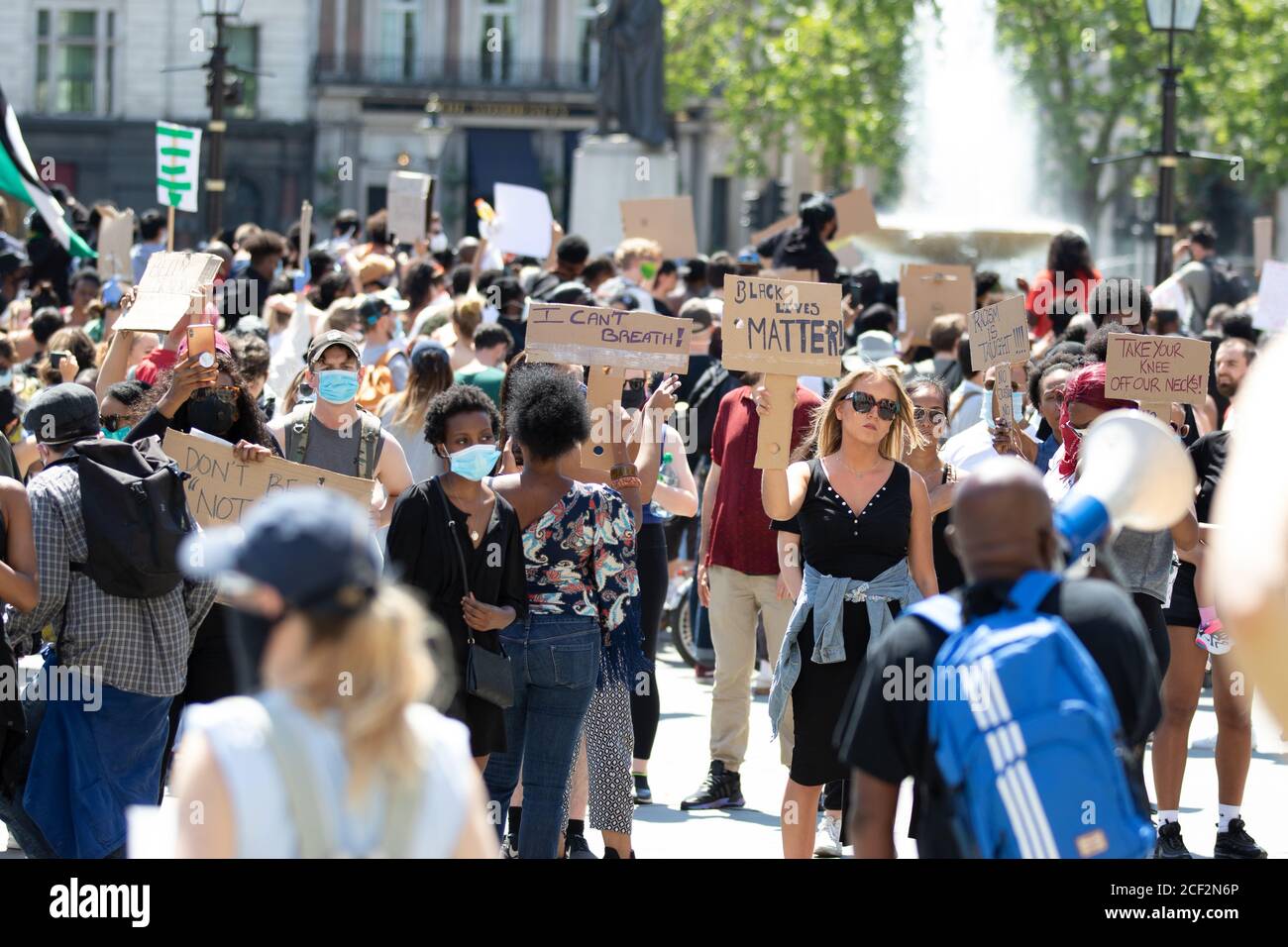 Protesters With Signs Black Lives Matter protesters hold signs at a protest in Trafalgar ...