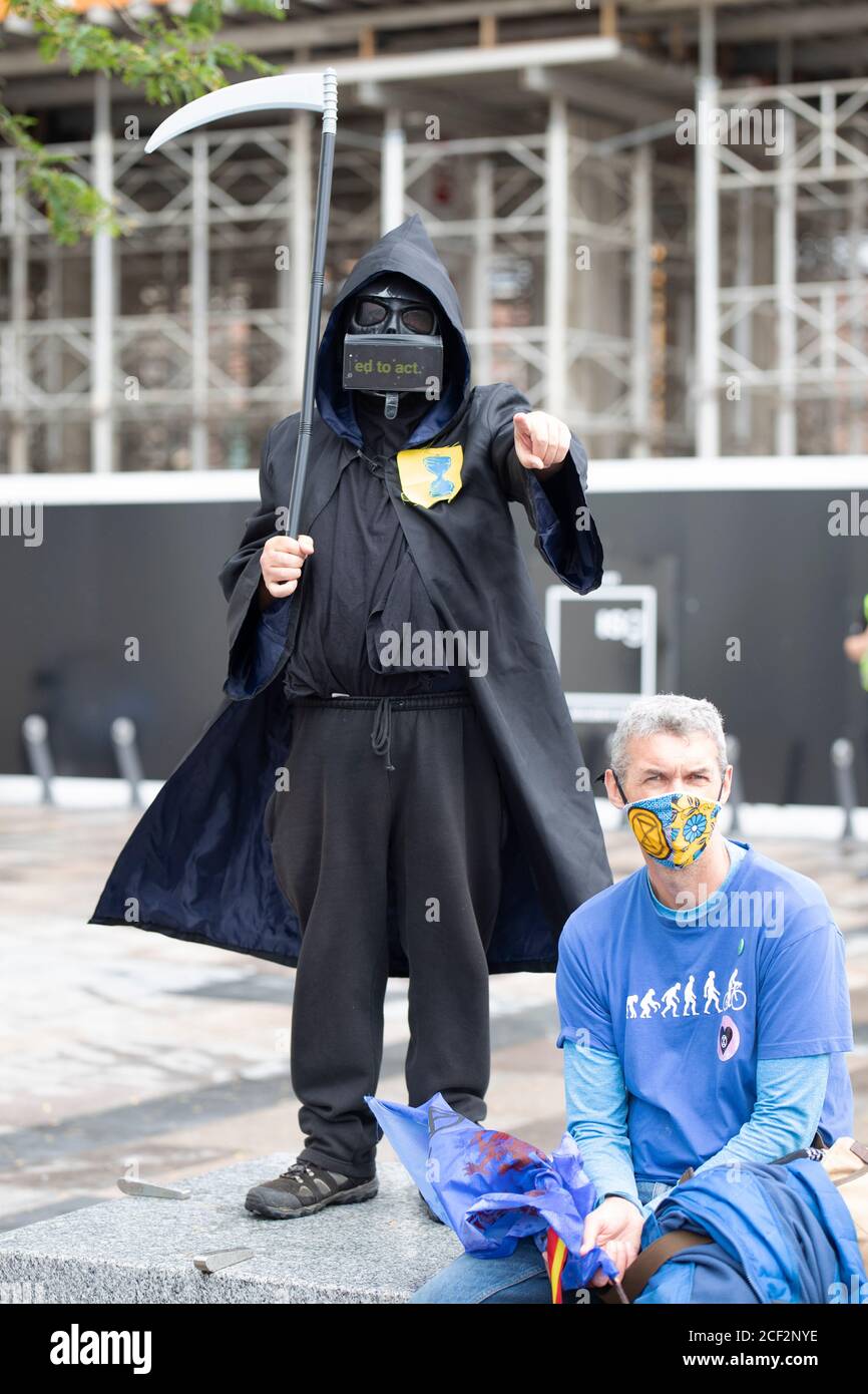 Cardiff, Wales, UK. 3rd Sep 2020. Extinction rebellion protestors outside the BBC on the third day of actions in Cardiff, 3rd September 2020. Protesters urge the BBC to tell the truth. A protestor dresses like the grim reaper Credit: Denise Laura Baker/Alamy Live News Stock Photo