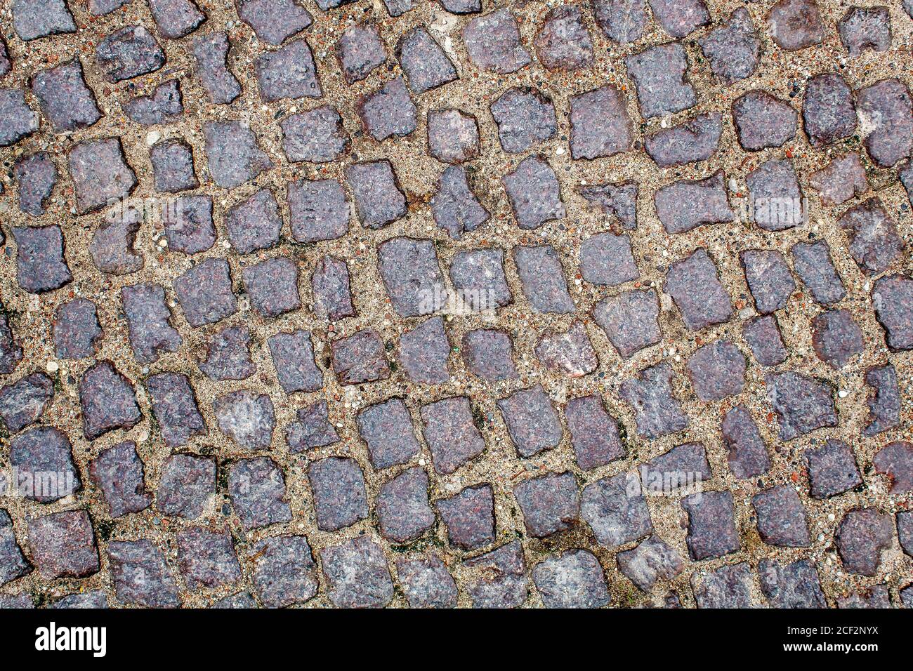 pavement of granite stone. old cobblestone road pavement texture ...