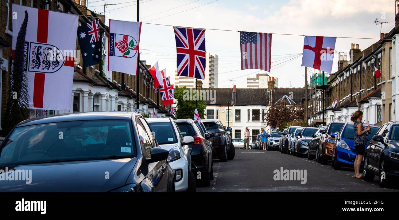 A street in Brentford flies flags from around the world - including England, USA, Australia and Poland - during the 75th Anniversary of VE Day. 8th Ma Stock Photo