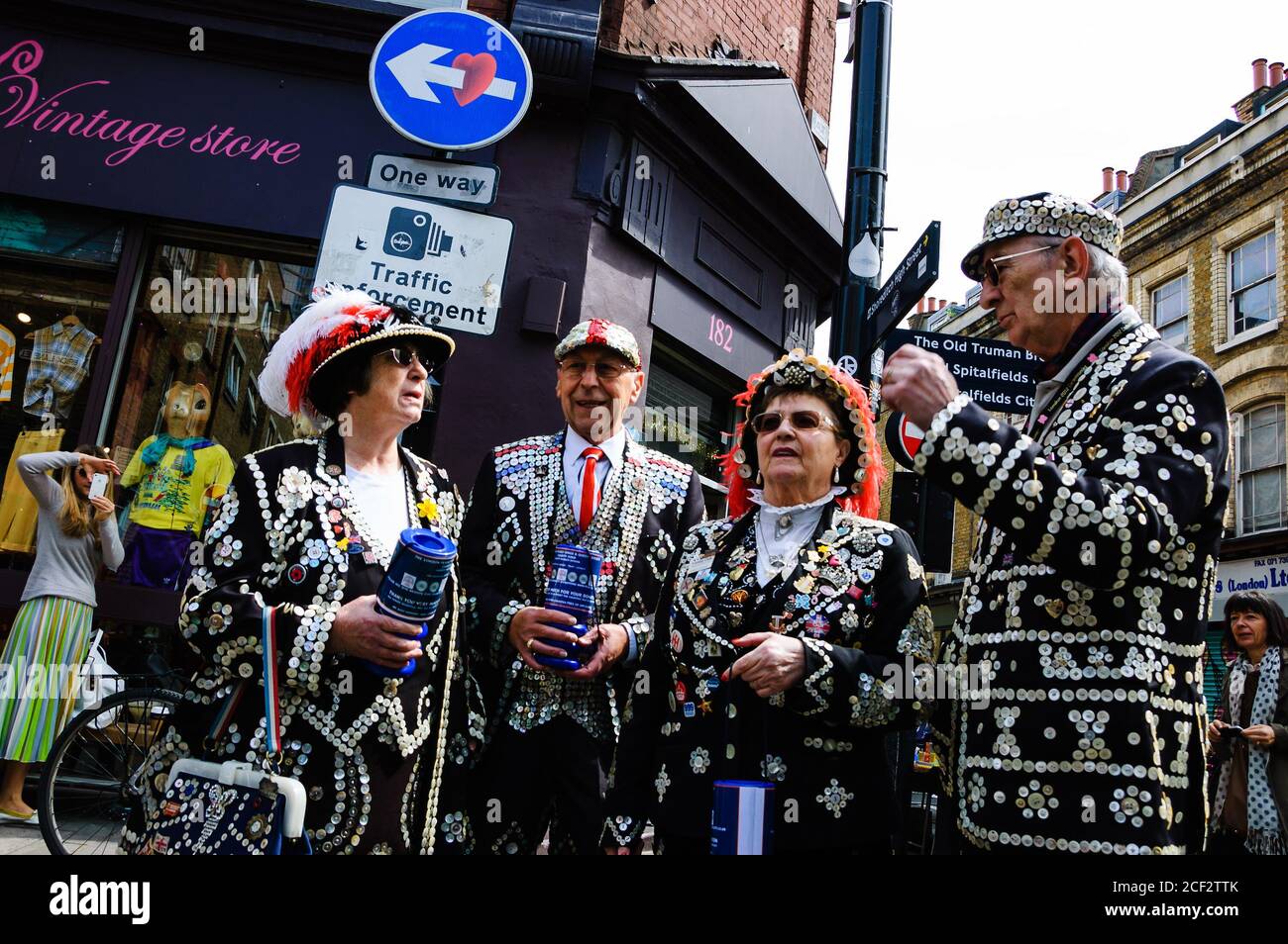 LONDON, ENGLAND, UK - MAY 4, 2014: Pearly Kings and Queens raise funds for charity near Cheshire Street and Brick Lane. Stock Photo