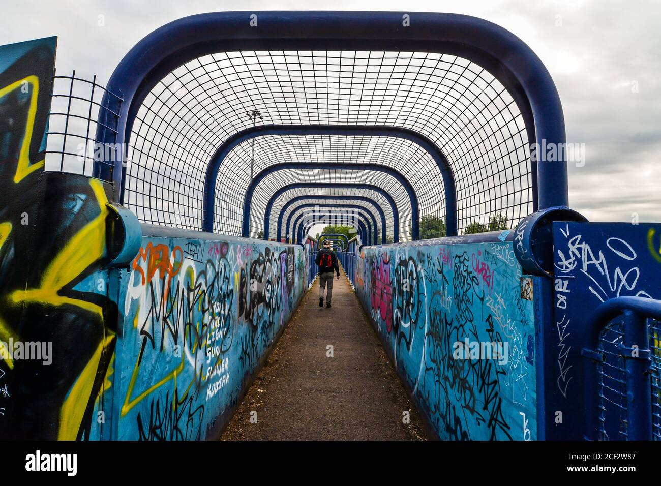 London/UK - 08/1/20 - A man walking through a tunnel bridge in Leyton Stock Photo