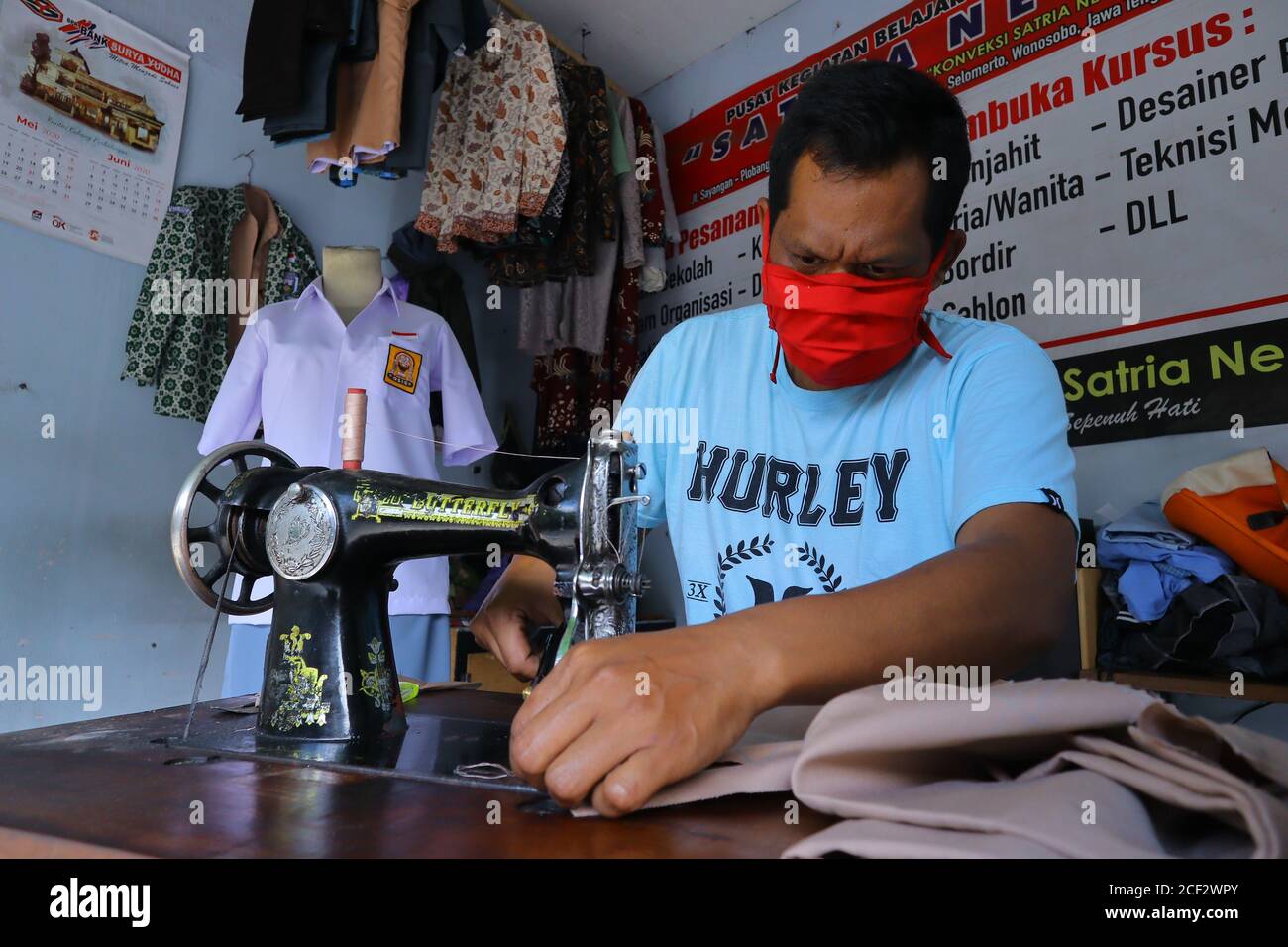 a photo of a tailor finishing his job Stock Photo