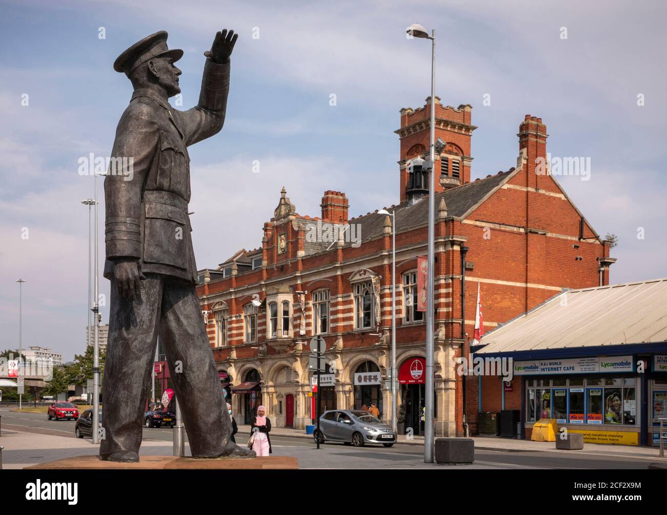 UK, England, Coventry, Hales Street, Millennium Place, Old Fire Station and statue of Sir Frank Whittle, inventor of the jet engine Stock Photo