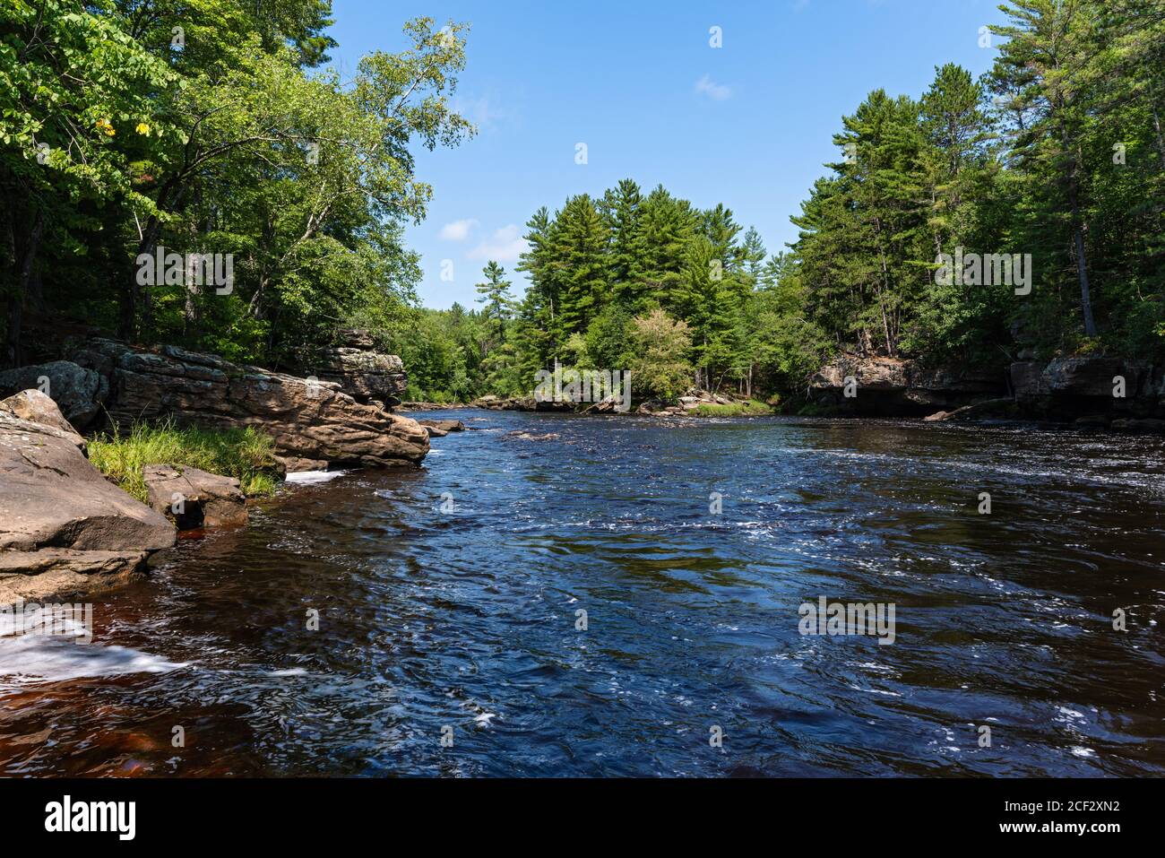 kettle river running through forest of banning state park in pine