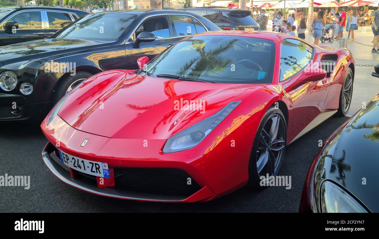 Monte-Carlo, Monaco - August 17, 2020: Red Ferrari 488 GTB Supercar Parked On The Casino Square In Monte-Carlo, Monaco, Europe. Close Up View Stock Photo