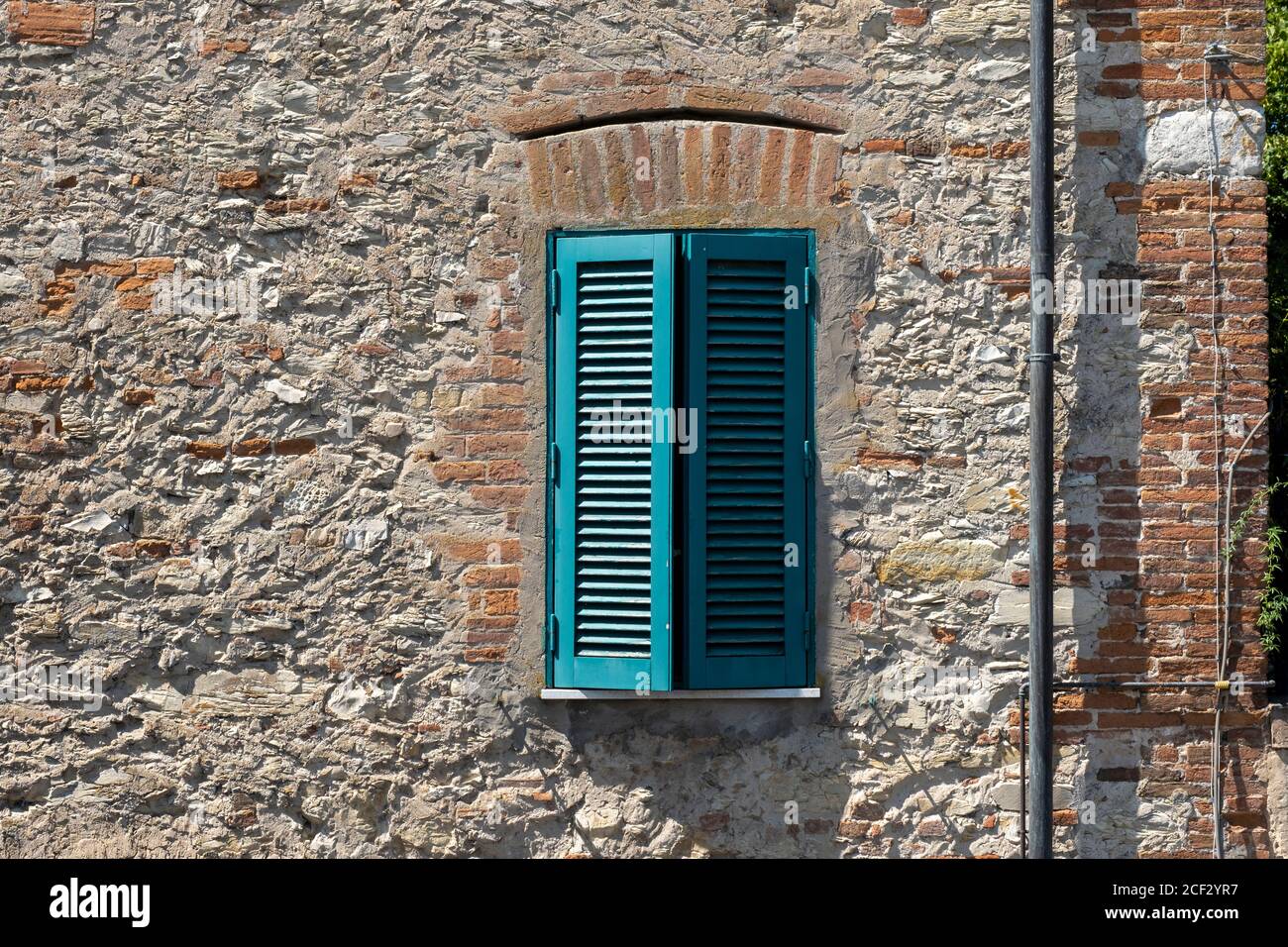 Italian Window with Wooden Shutters in a brick wall Stock Photo Alamy