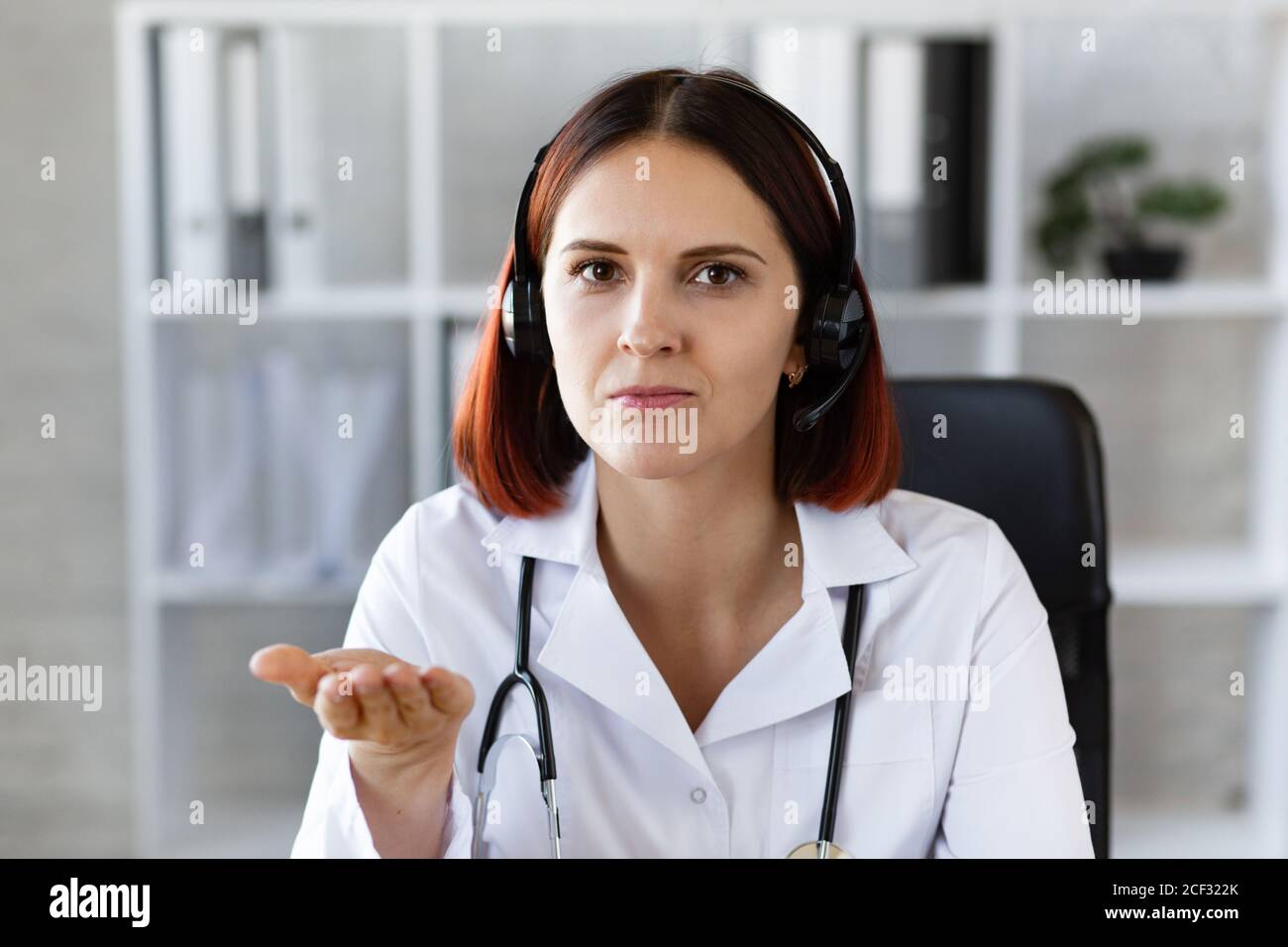 Woman Doctor Consults By Video Call Online Medical Assistance Video Conferencing Of Medical Professionals Portrait Of A Doctor At The Workplace Stock Photo Alamy