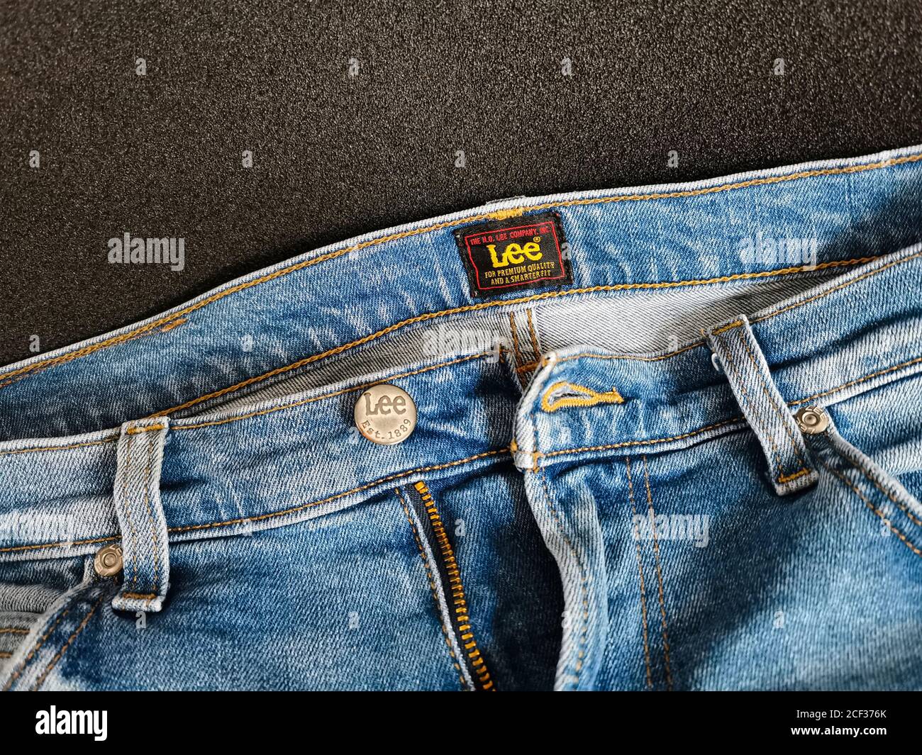 Lee american brand jeans. Close up of the Lee button on a blue men's jeans.  This is an American manufacturer, founded in 1889. Photo taken in Warsaw  Stock Photo - Alamy