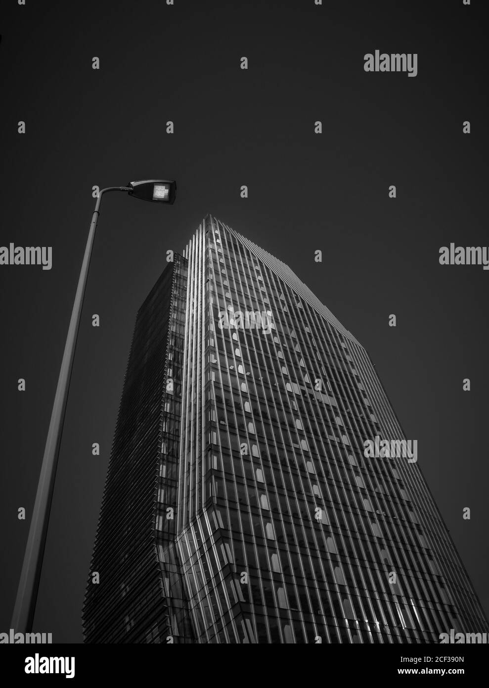 Milan/Italy- July 14, 2019: the modern glass Diamond tower in new Porta Nuova business district, by night Stock Photo