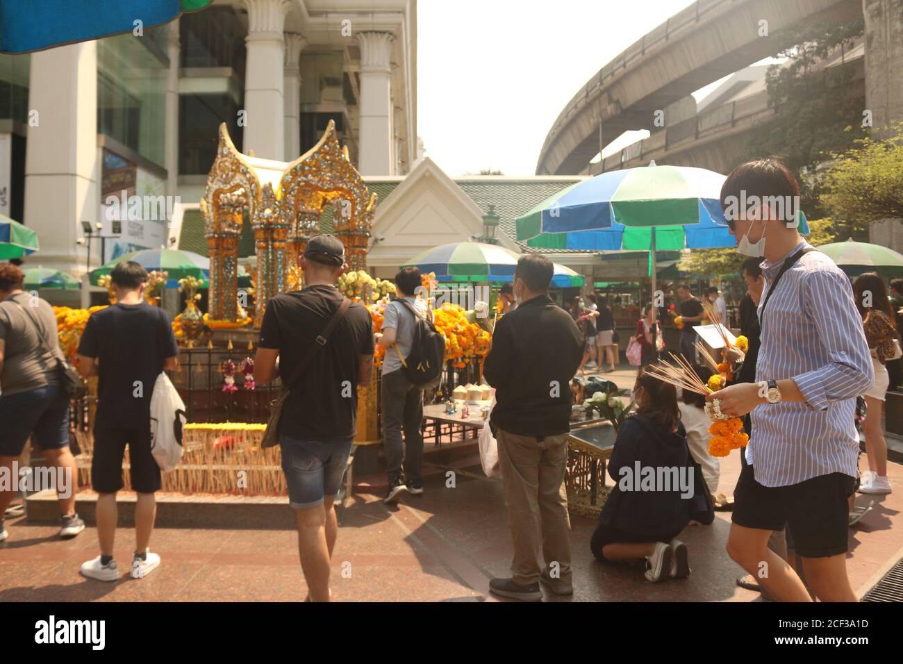 BANGKOK, THAILAND - Feb 20, 2020: Wat eriwan, buddah shrine, Bangkok city, Thailand, February 20, 2020: thai people with Corona mask praying at a budd Stock Photo