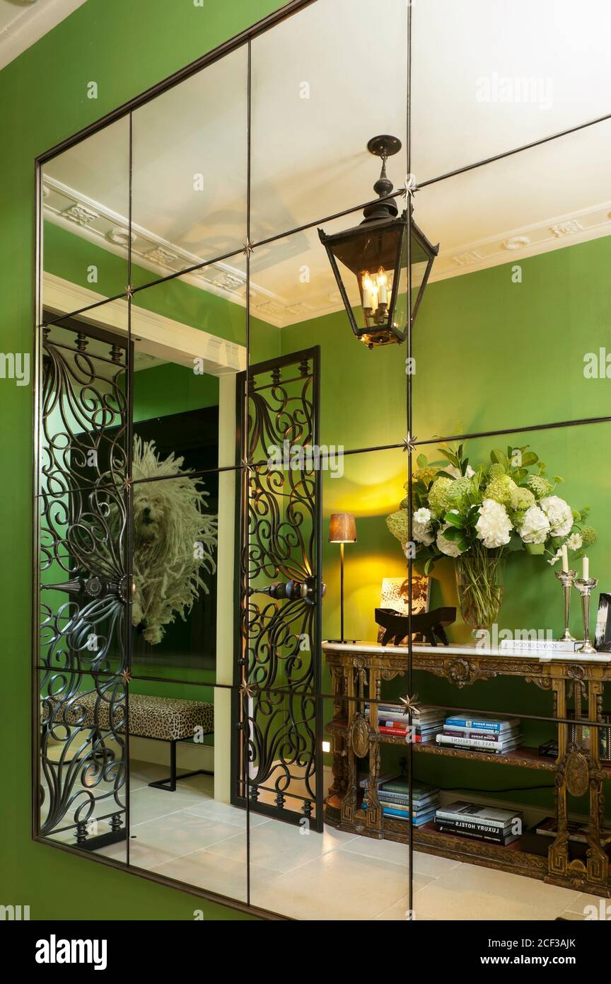 Green entrance hall reflected in mirror Stock Photo Alamy