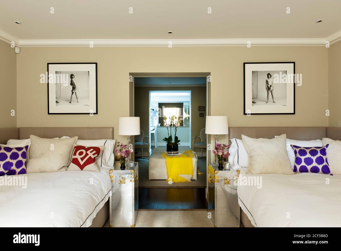 Two double bed in modern bedroom Stock Photo - Alamy