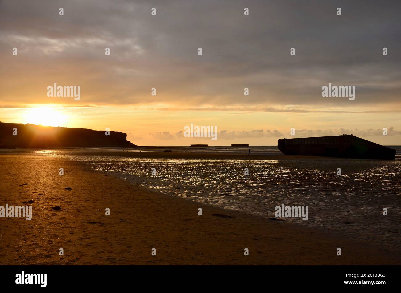 Sunset at coast of the town ArromancheslesBains on English Channel in