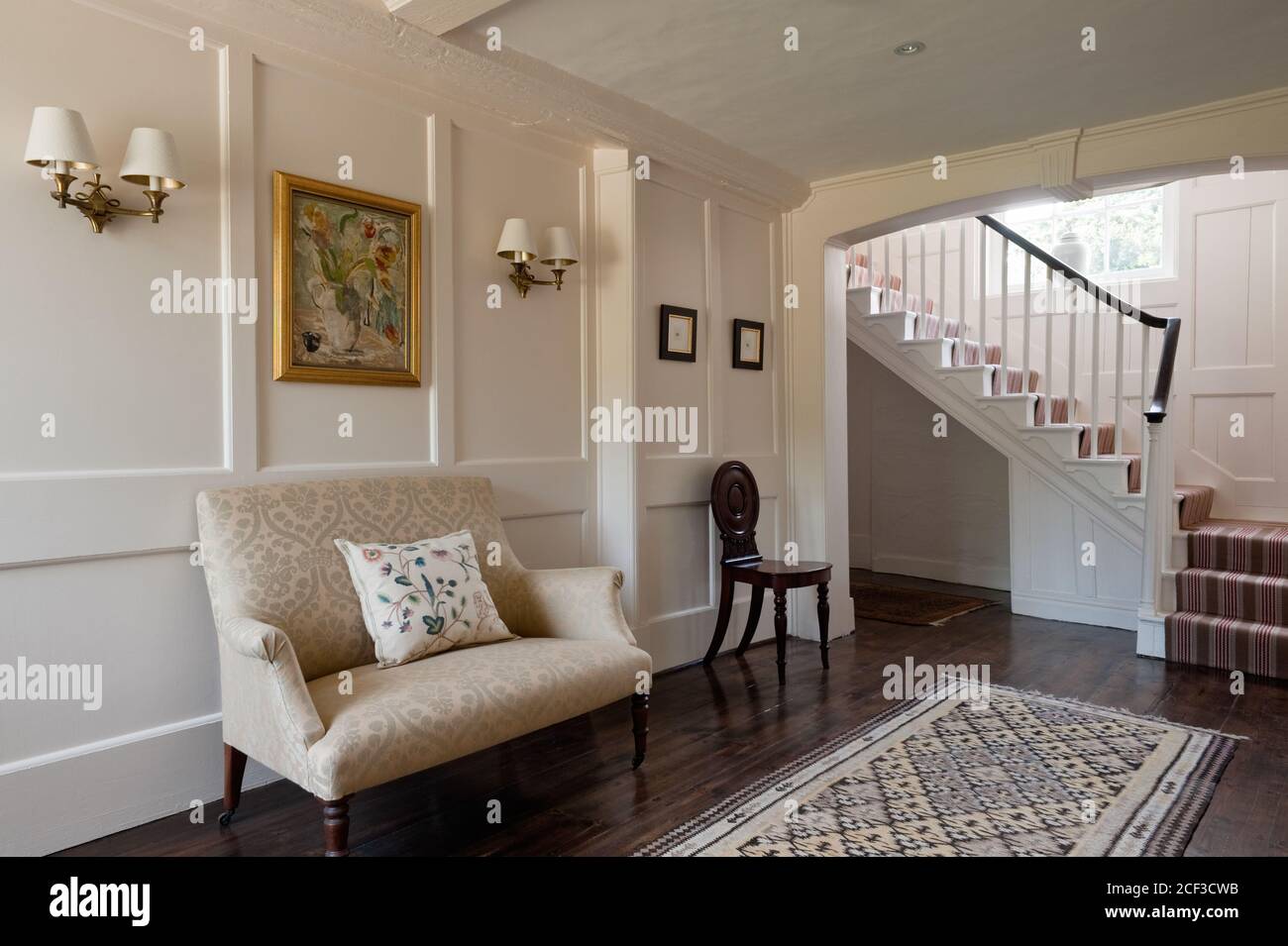 Oversized armchair in entrance hall Stock Photo