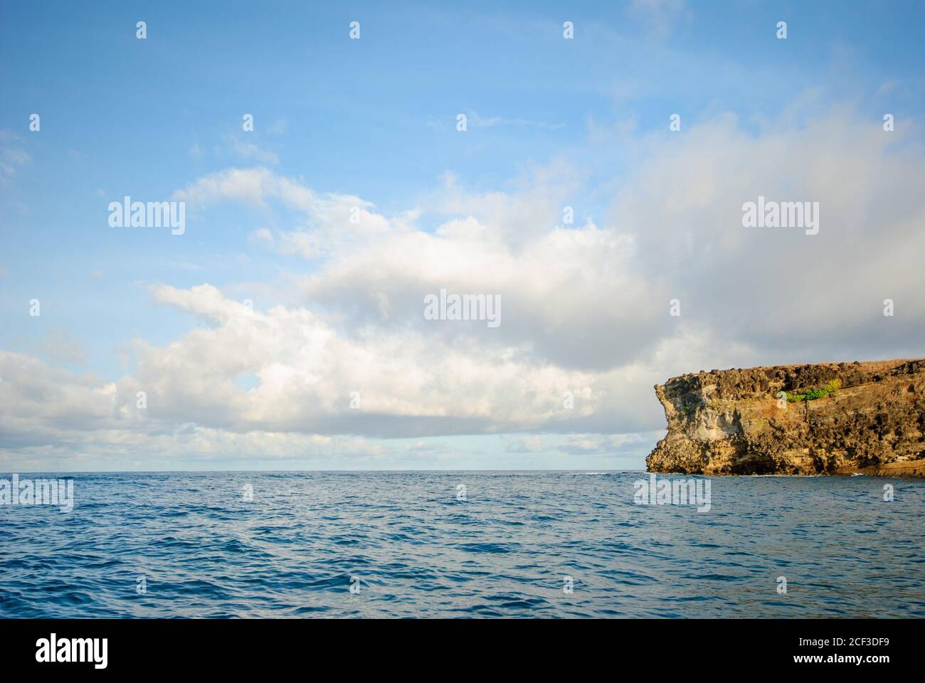 Minimalist view of the island in Zambales, Philippines with the clouds in the backgroud. Stock Photo