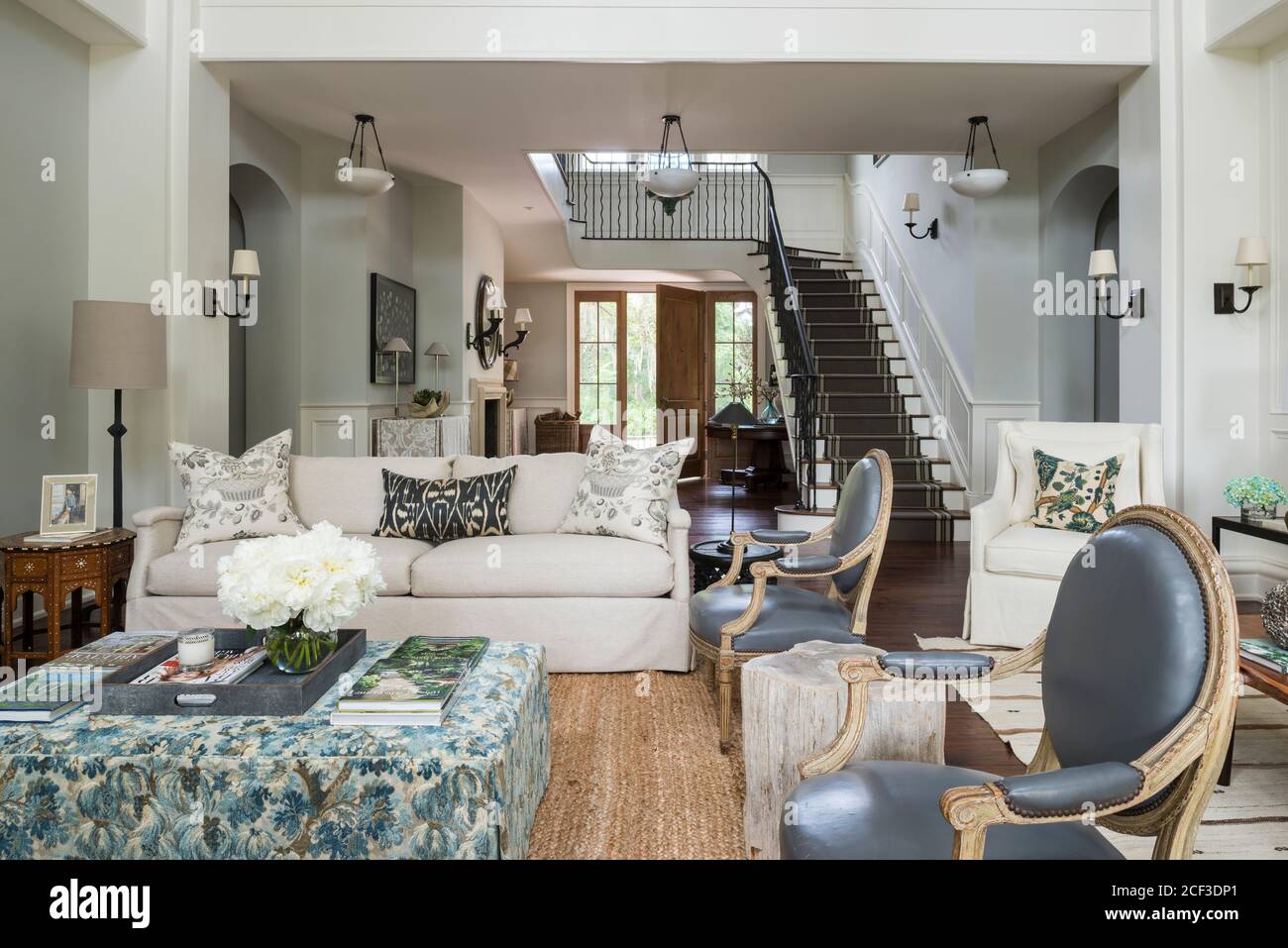 Country style living room with matching armchairs Stock Photo Alamy