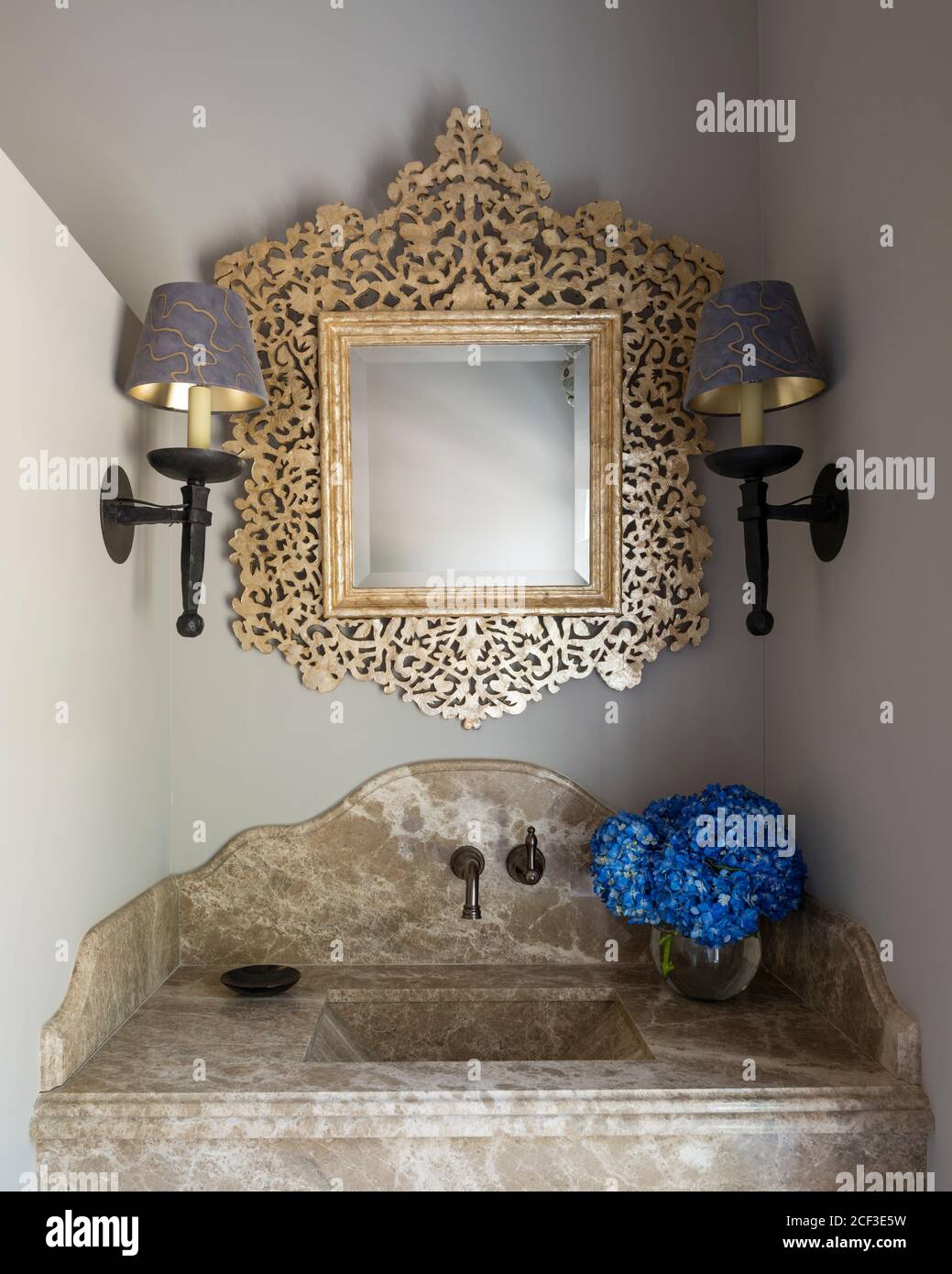 Gold mirror over bathroom sink Stock Photo Alamy