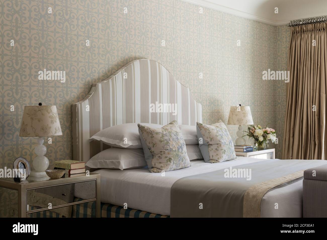 Bedroom with striped headboard Stock Photo