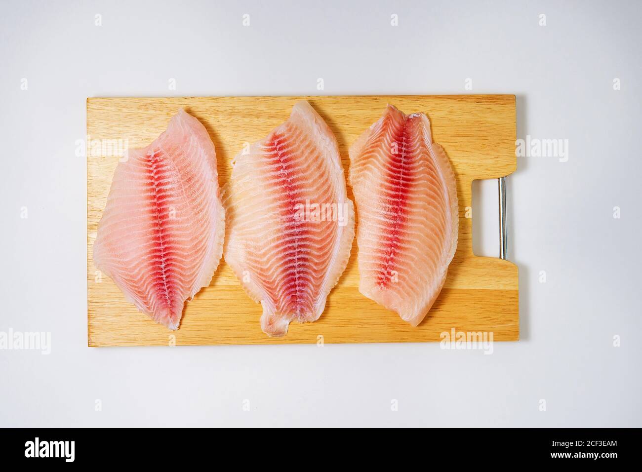 fresh fish fillet with ingredients for cooking, top view. home cooking