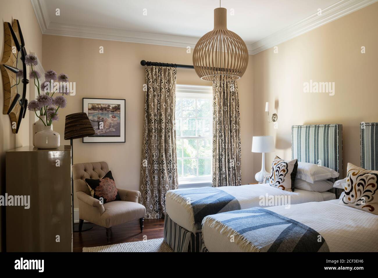 Single beds in country style bedroom Stock Photo Alamy