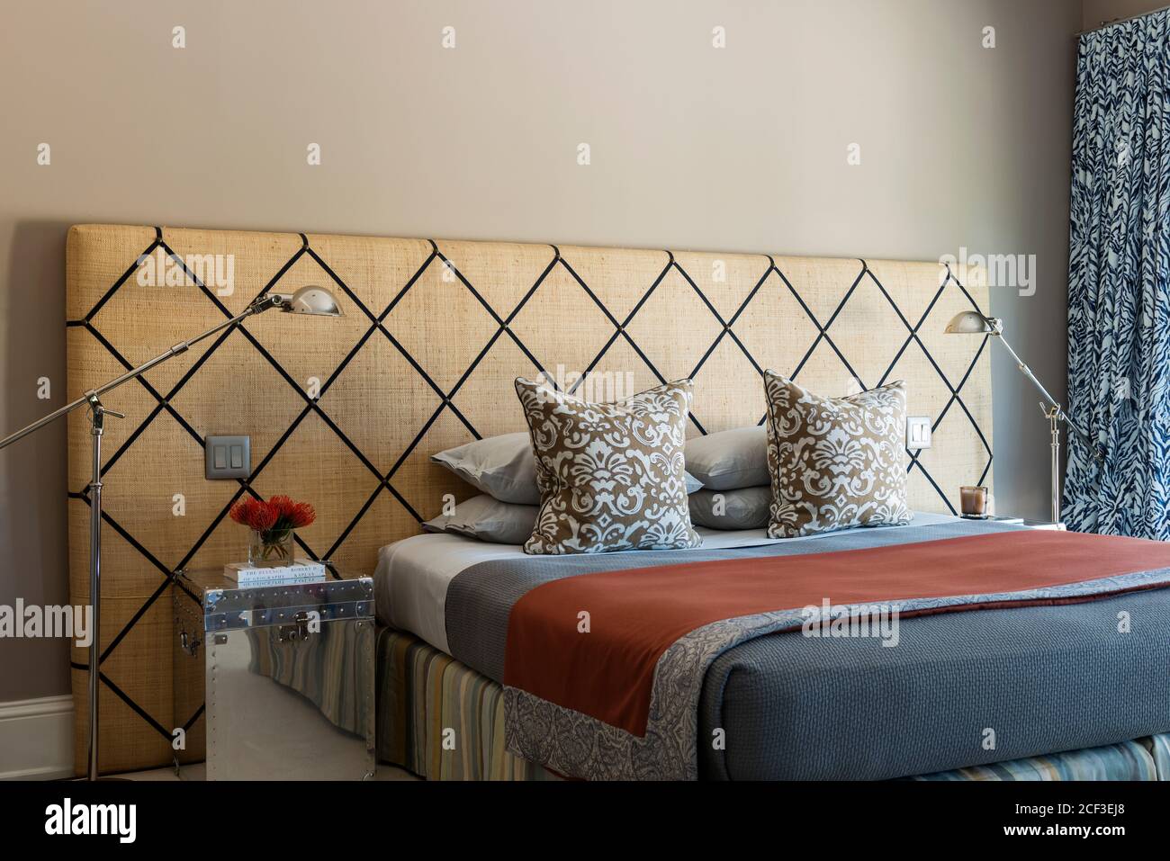Contemporary bedroom with checked headboard Stock Photo