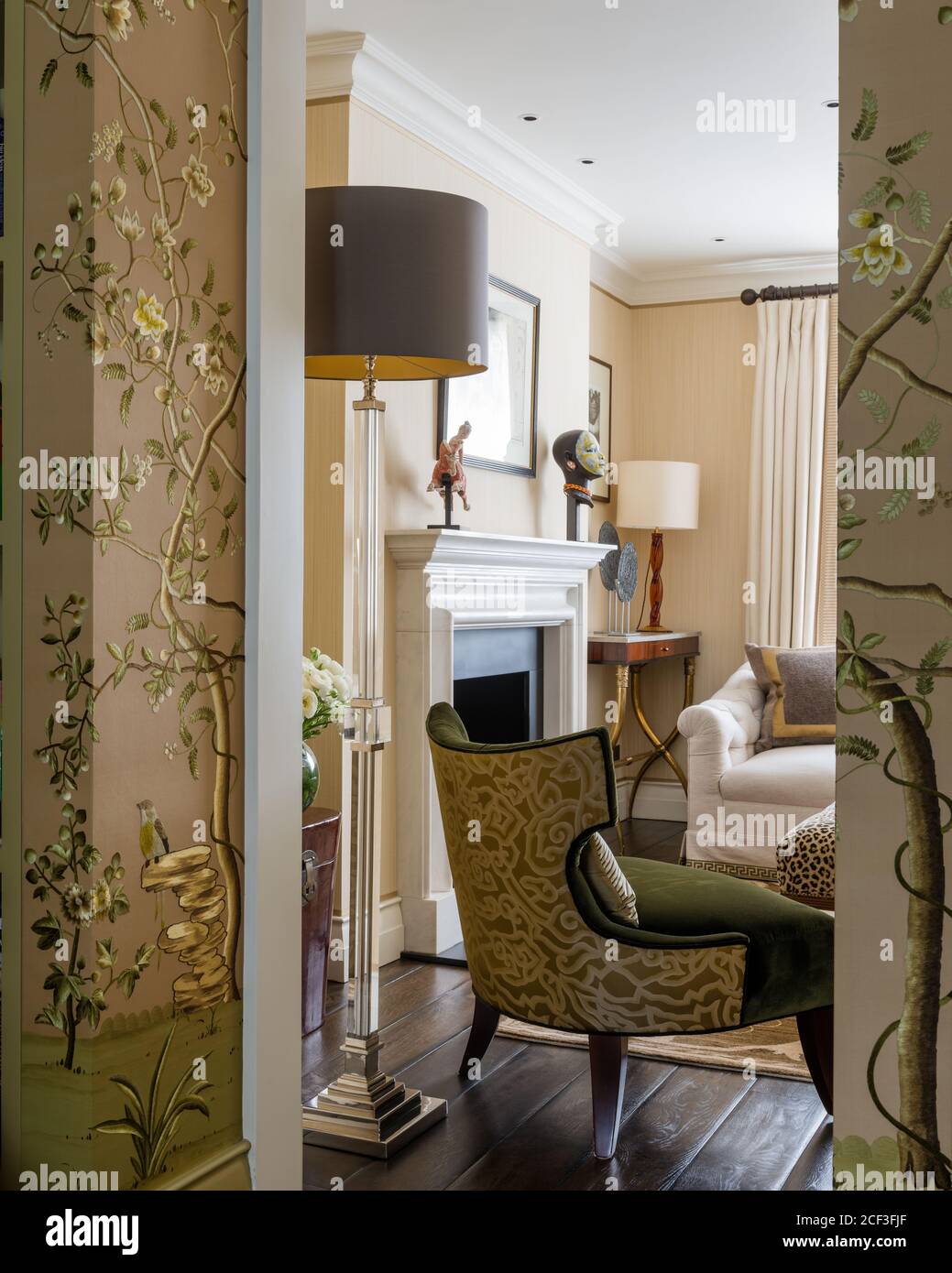 Doorway to living room with patterned chair Stock Photo Alamy