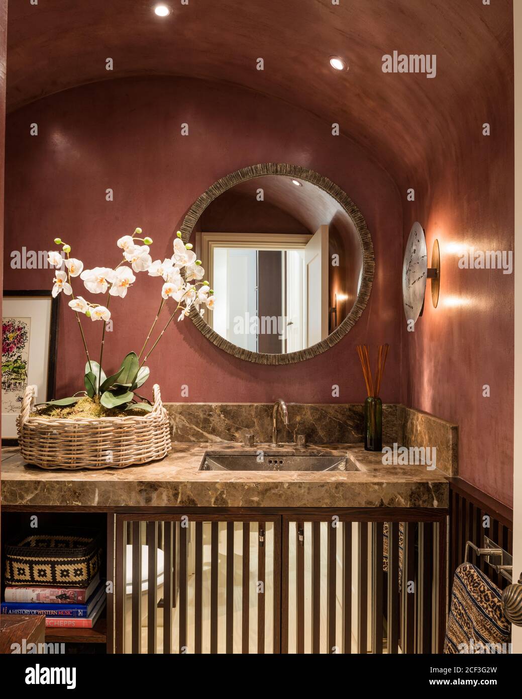 Brown toned bathroom with orchids Stock Photo