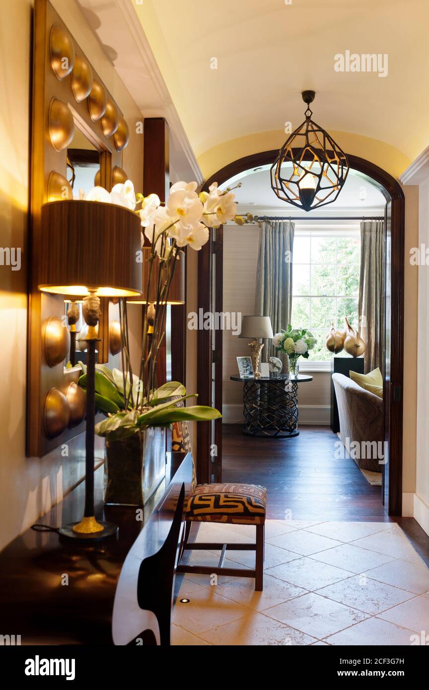 Mirror above table in hallway Stock Photo Alamy