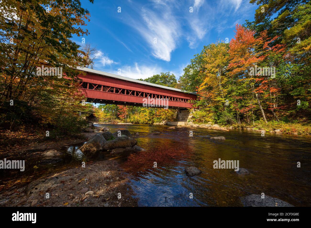 Swift River covered bridge in autumn from the river, Conway, New Hampshire Stock Photo