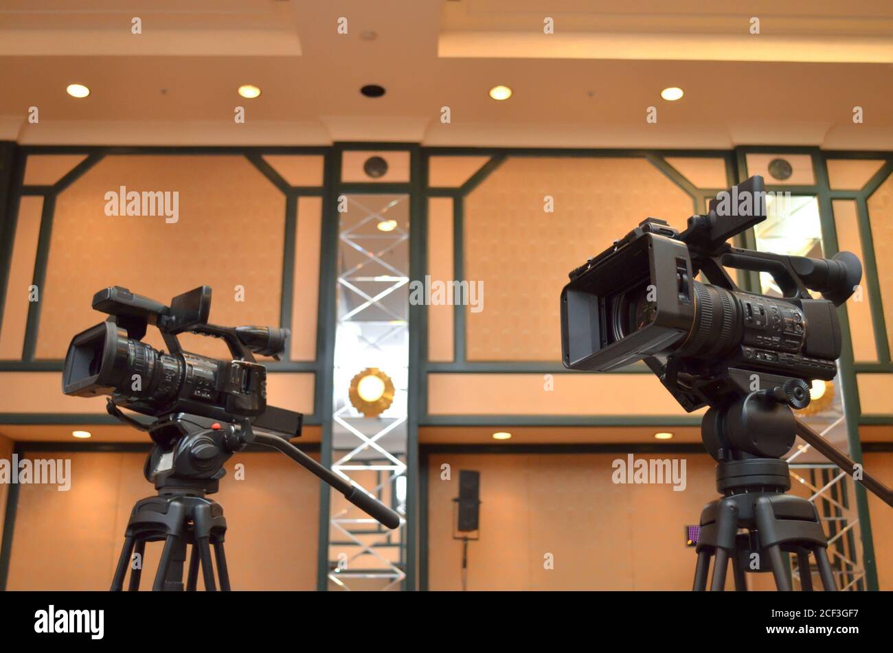 Two professional video cameras close up in the conference room Stock Photo