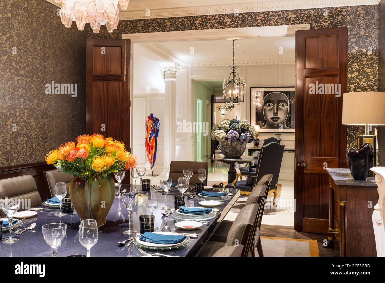Set table in luxurious dining room Stock Photo