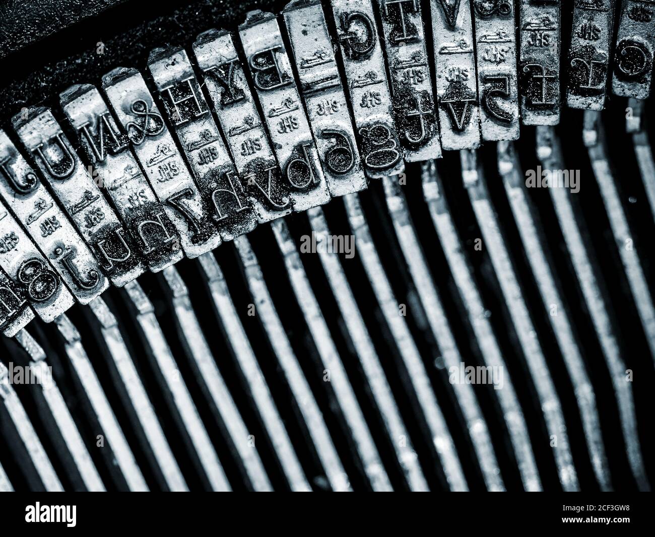 Typewriter Type bars close-up, in blue tone Stock Photo