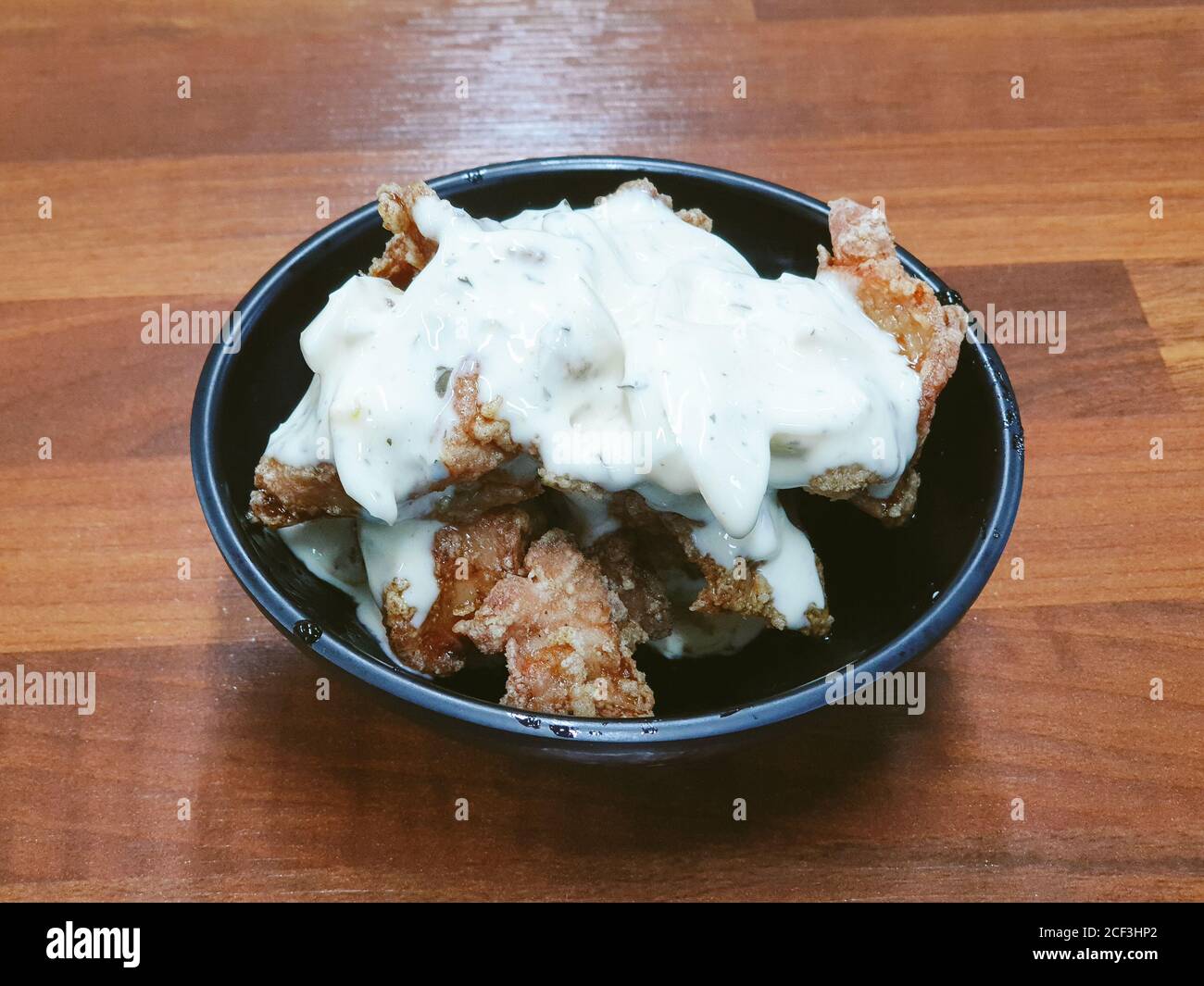 Chicken Nanban, fried chicken soaked in sweet and sour sauce topped with tartar sauce. Miyazaki prefecture specialty chicken dish. Stock Photo