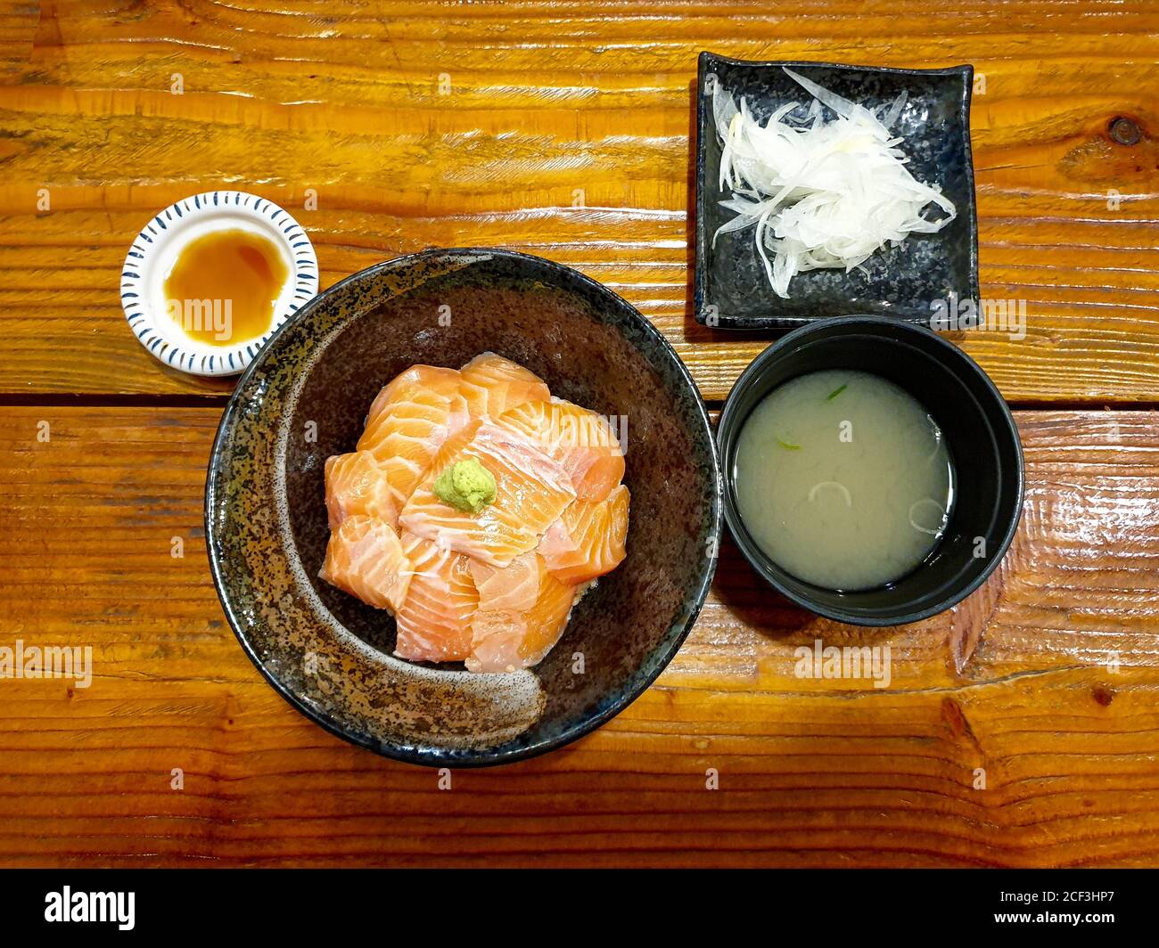 Sake-Don, salmon rice bowl with soy-wasabi sauce. Small restaurant near the university in Seoul, South Korea. Popular for fresh salmon dishes. Stock Photo