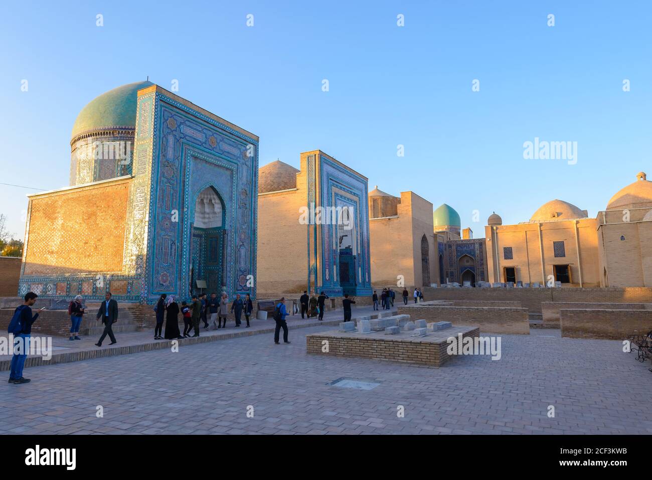 Shah-i-Zinda Necropolis in Samarkand, Uzbekistan. Tourists in Shah i Zinda Complex of mausoleums. Stock Photo