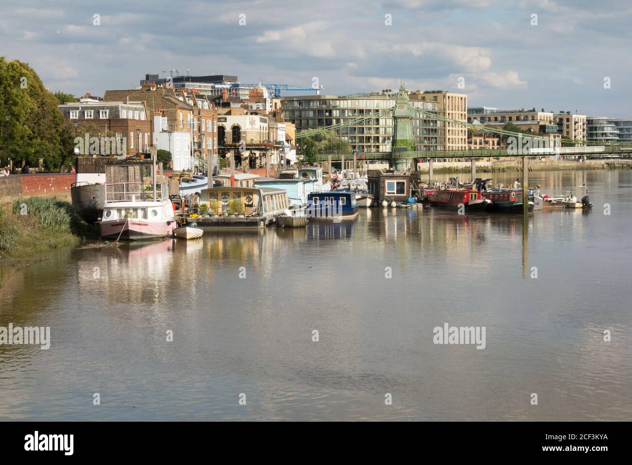Houseboats moored on the River Thames by Furnival Gardens, Hammersmith, London, UK Stock Photo