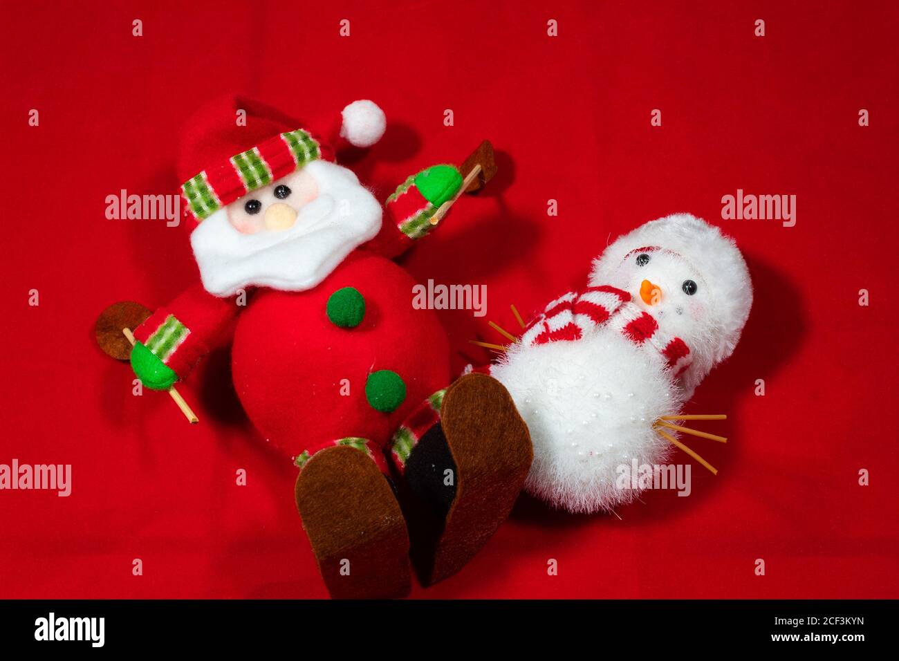 red christmas background with toy snow man and a santa claus, with ...