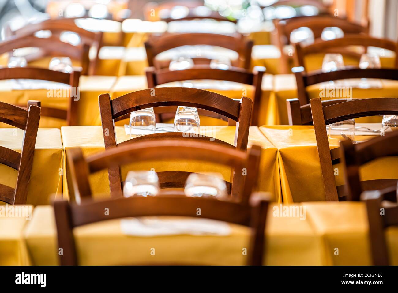 Closeup pattern of empty tables outside restaurant cafe open by street