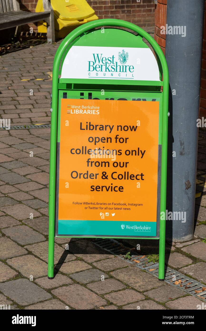 Sign outside a UK library stating that it is now open for collections open during the 2020 coronavirus covid-19 pandemic Stock Photo
