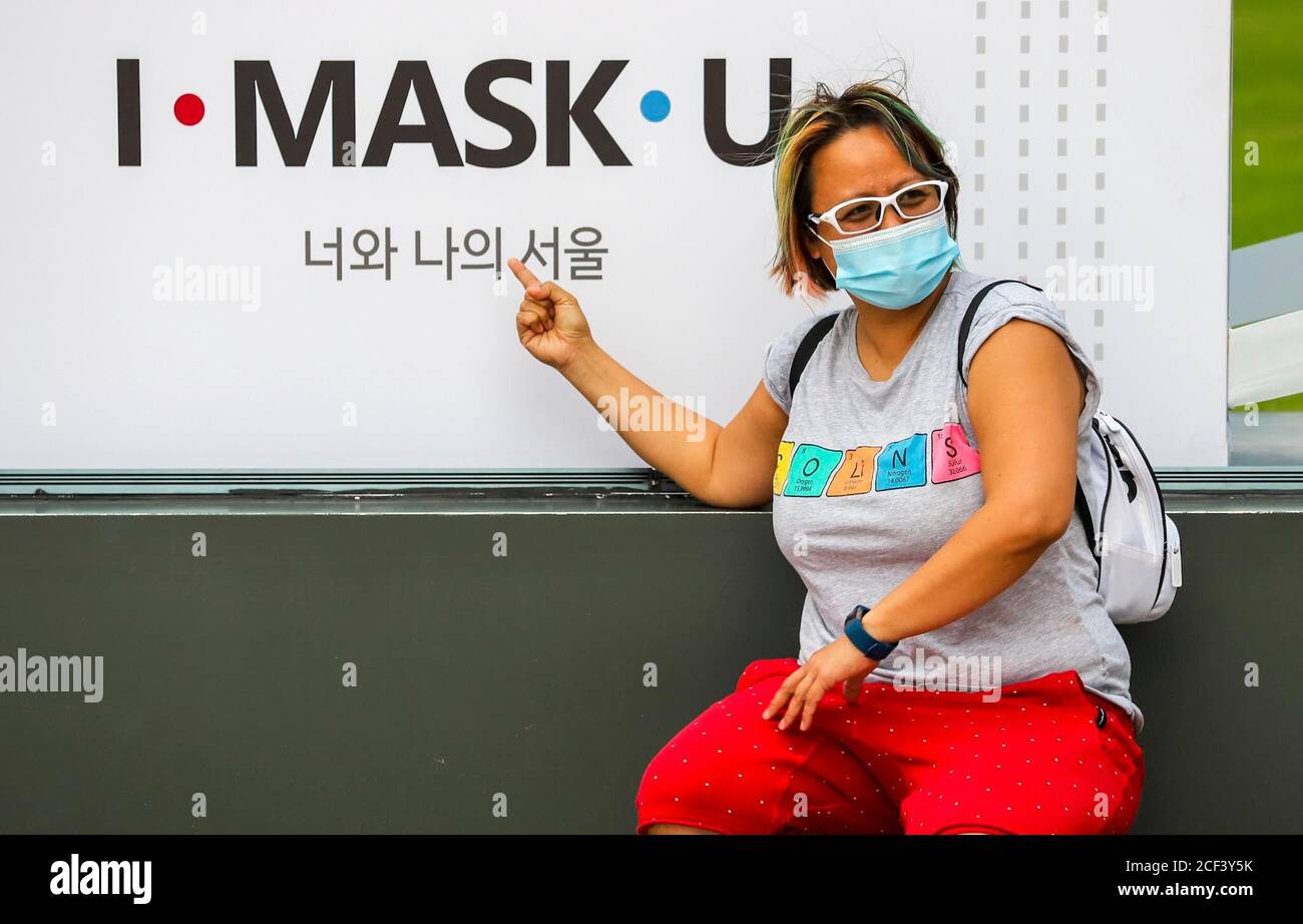 Seoul, South Korea. 3rd Sep, 2020. A visitor poses in front of a slogan that reads I-MASK-U on the structure of Seoul City Hall Plaza. Credit: Won-Ki Min/ZUMA Wire/Alamy Live News Stock Photo