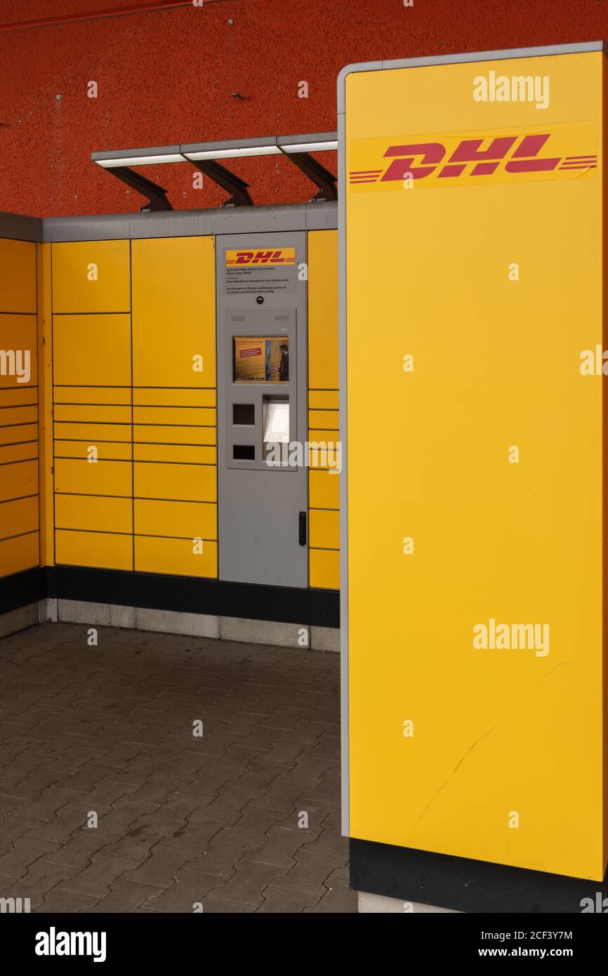 DHL Packstation, where customers can pick up their order themselves and  also send packages. Portrait view Stock Photo - Alamy