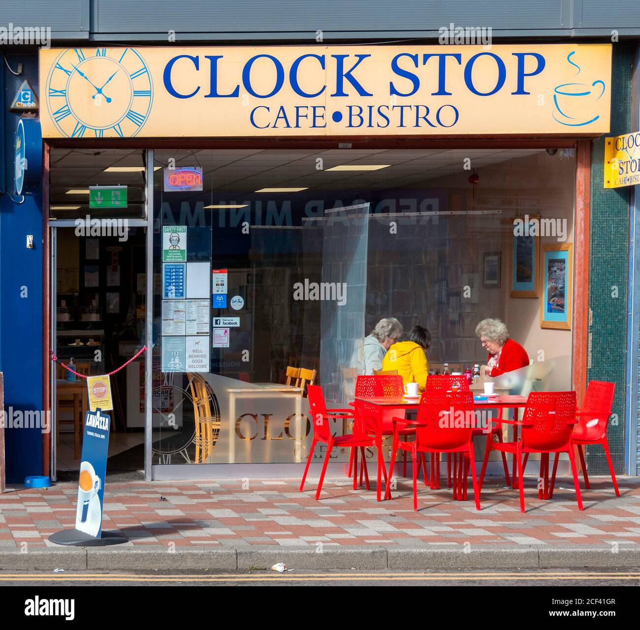 Customers enjoying refreshment at Clock Stop café  Bistro by the town clock in the centre of Redcar Cleveland North Yorkshire Stock Photo