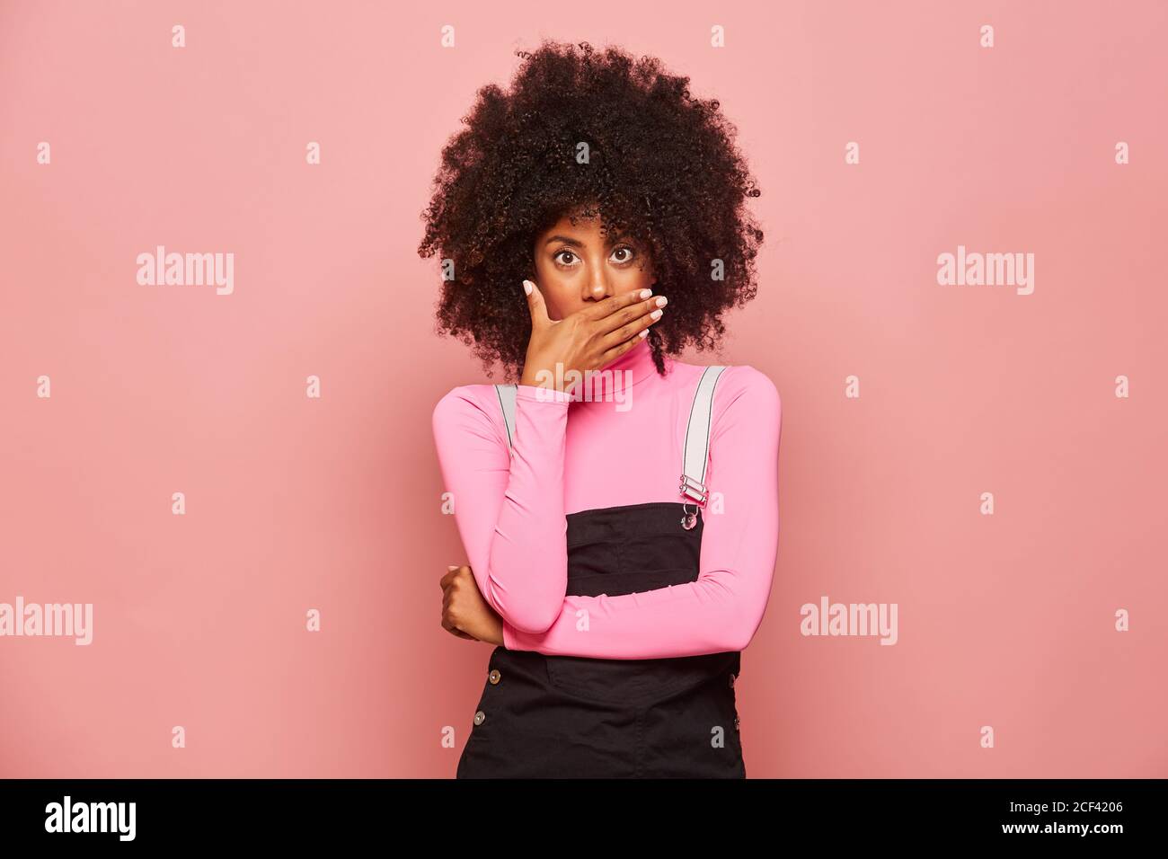 Shocked African American Woman looking at camera Stock Photo