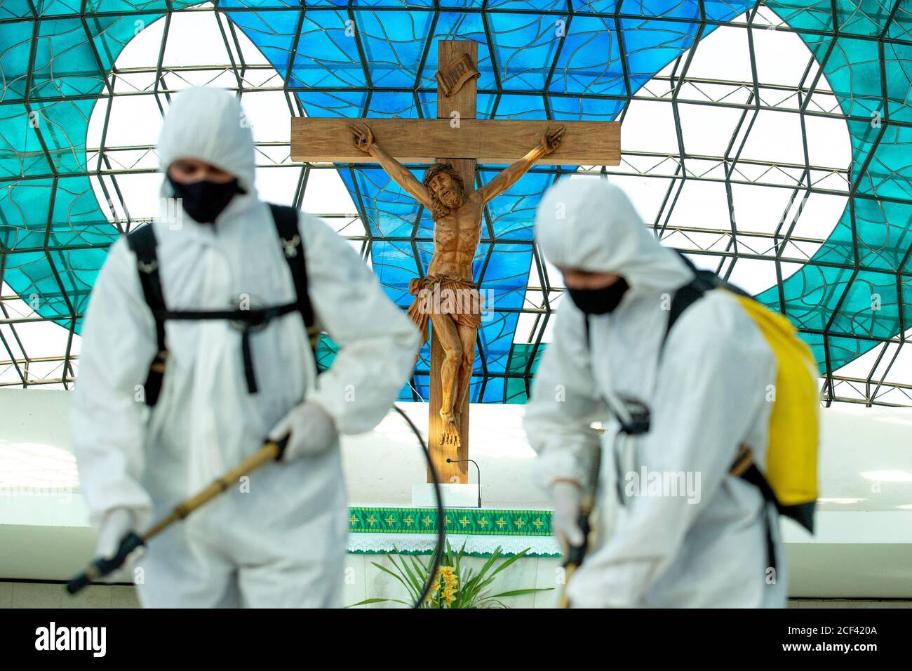 03 September 2020, Brazil, Brasília: Members of the army in protective suits disinfect the cathedral Nossa Senhora Aparecida. According to official information, Brazil may cross the border of 4 million Covid-19 infected people. According to the government, the mortality rate is 3.1 percent. Photo: Myke Sena/dpa Stock Photo