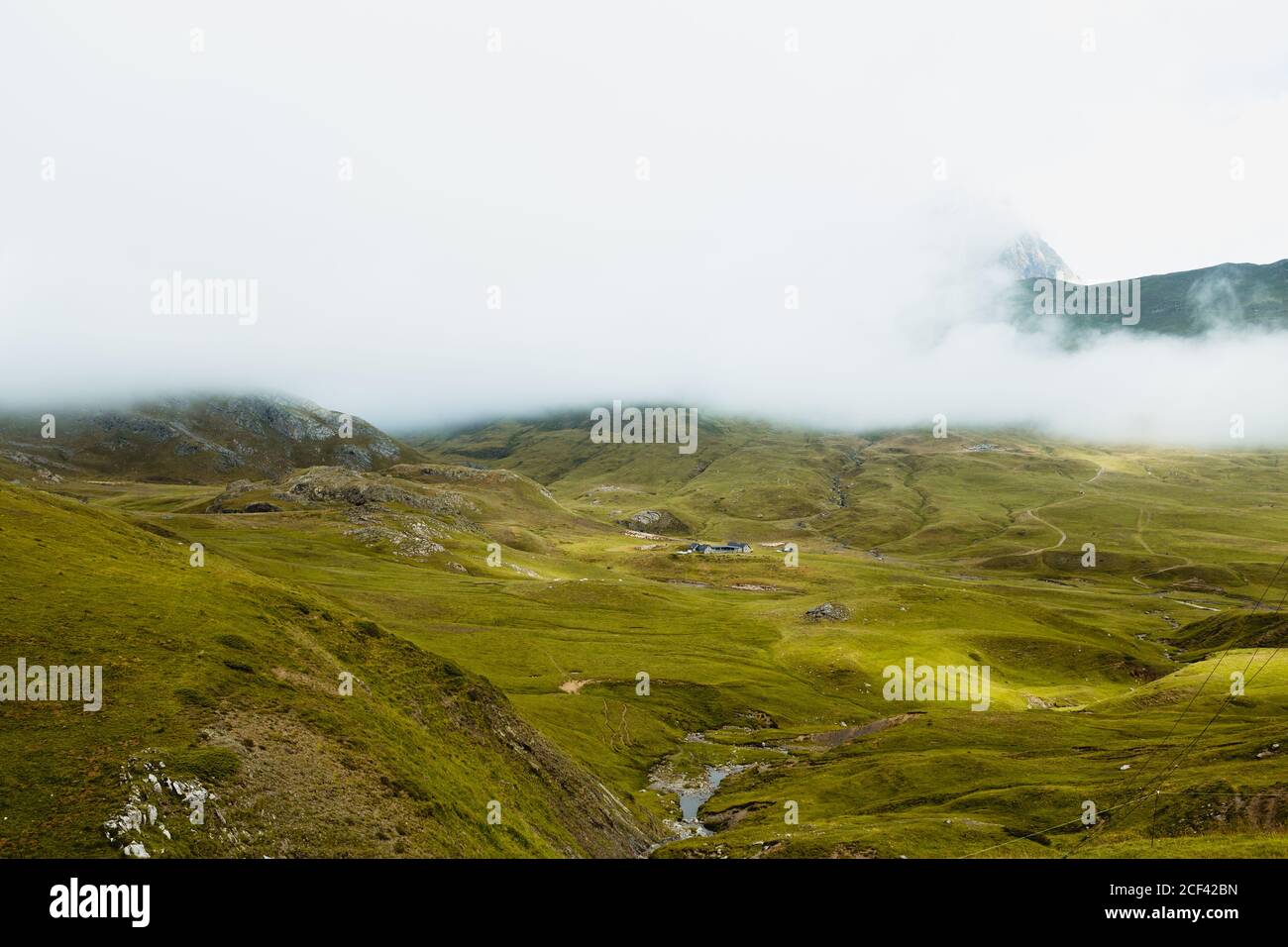 Fog over beautiful hilly terrain Stock Photo