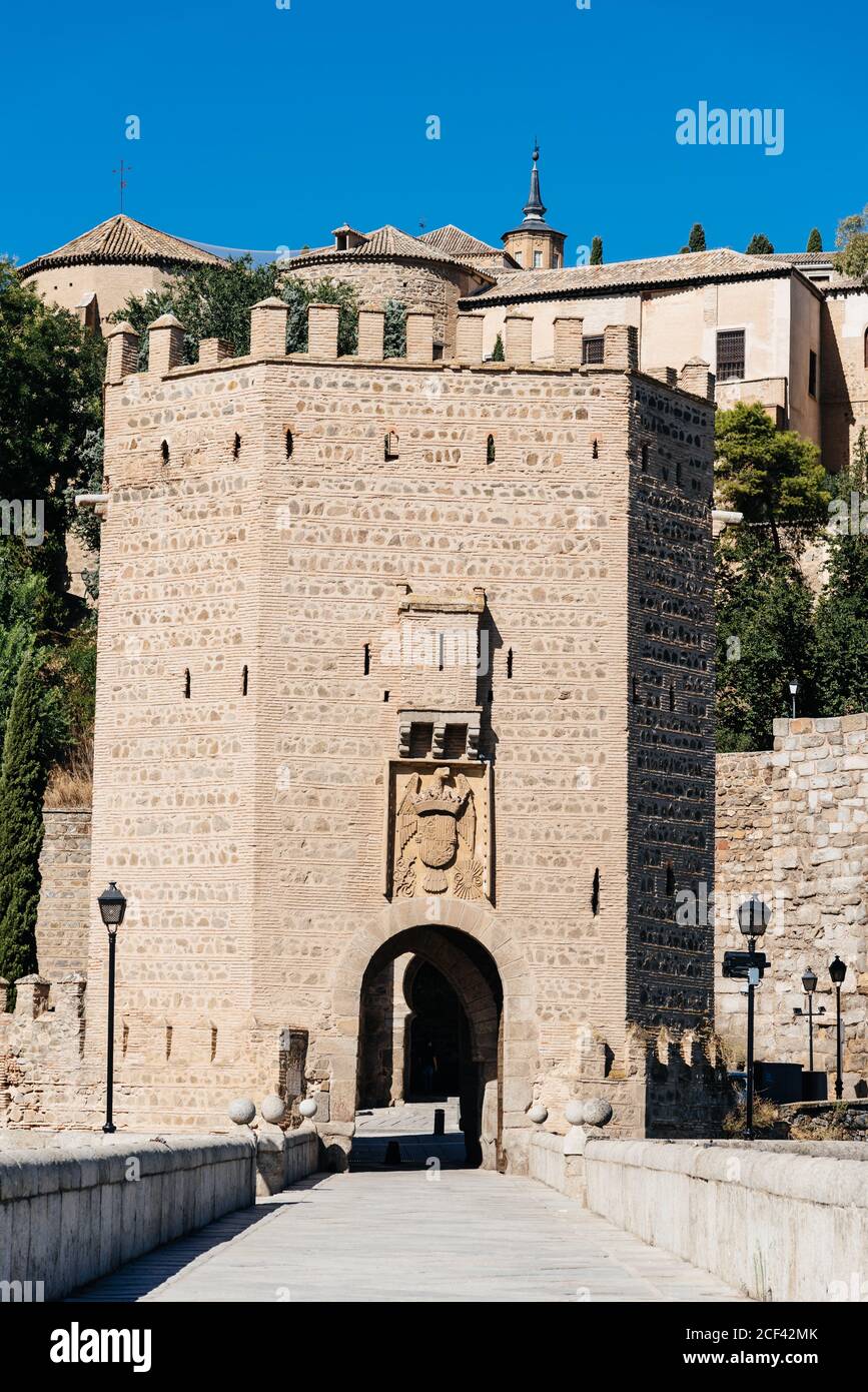 Alcantara Bridge against Toledo cityscape on summer day. Panoramic view Stock Photo